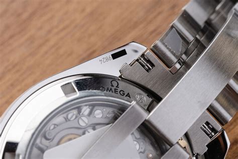 do omega watches have branding on back|omega watch serial number location.